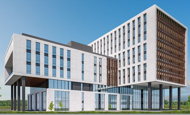 Rückansicht des modernen Gebäudekomplexes mit Stelzenbauweise